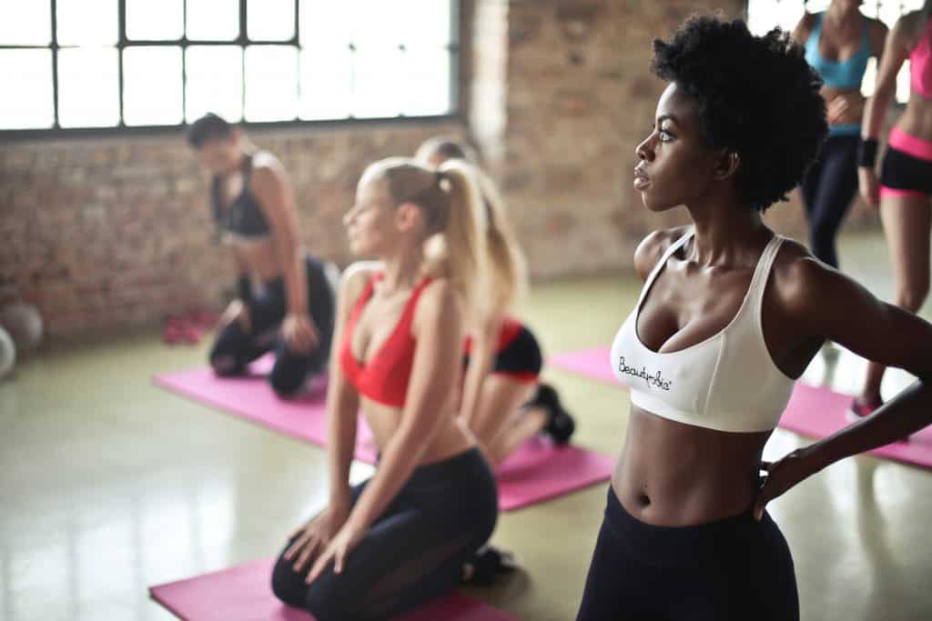 Focused disciplined women working out